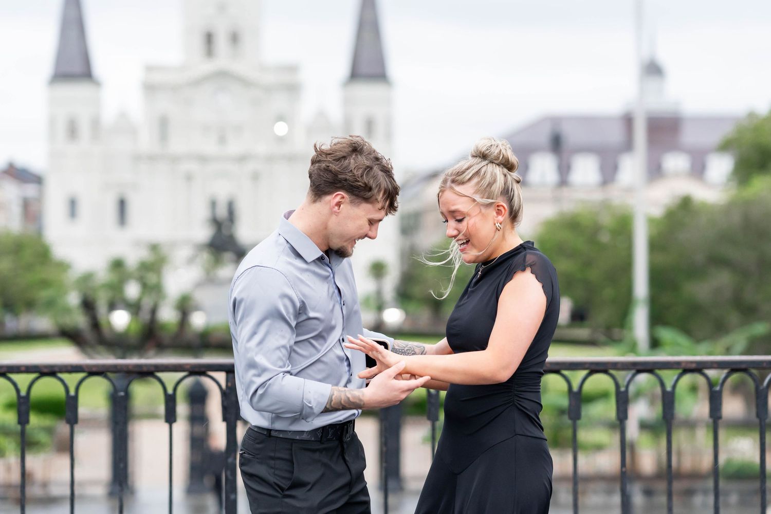 girlfriend becomes a fiancé and looks at her ring with boyfriend