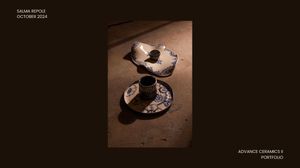Top-down view of broken and intact blue and white ceramic pieces on warm wooden surface in portfolio.