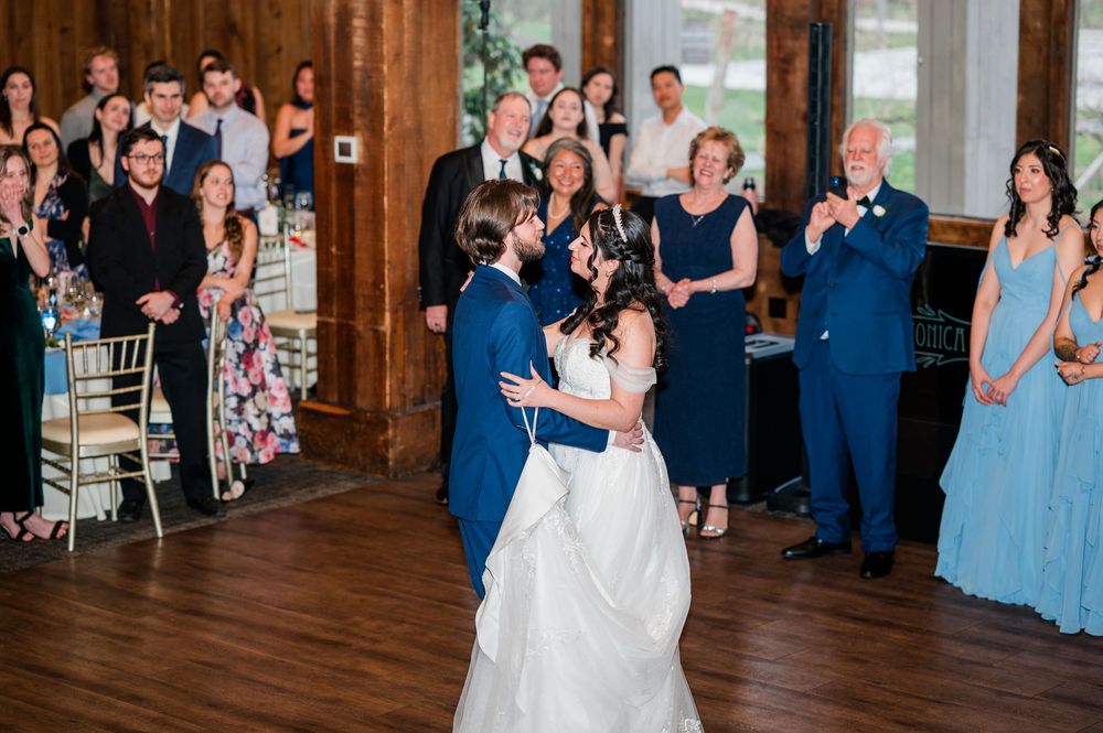 Bride and groom sharing their first dance at an elegant wedding reception.