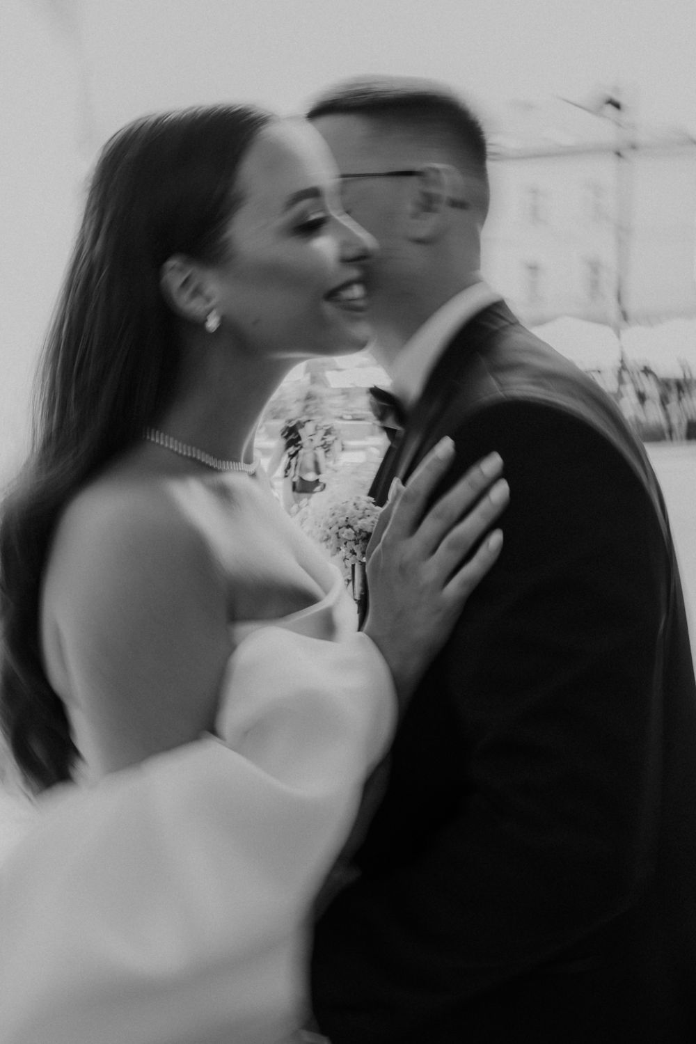 Romantic black and white portrait of couple sharing tender moment.
