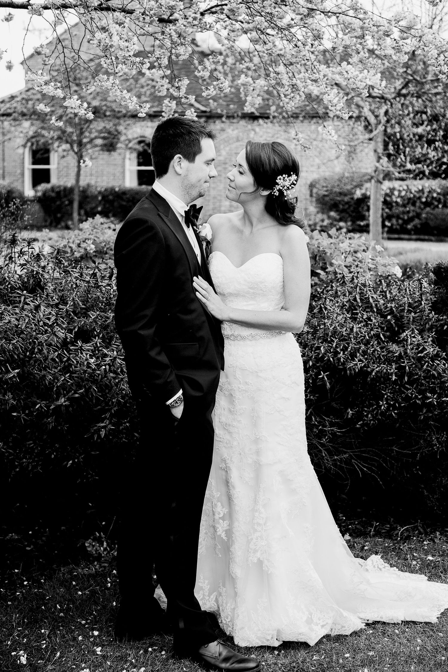 Tylney Hall wedding photography showing the bride and groom in the beautiful grounds