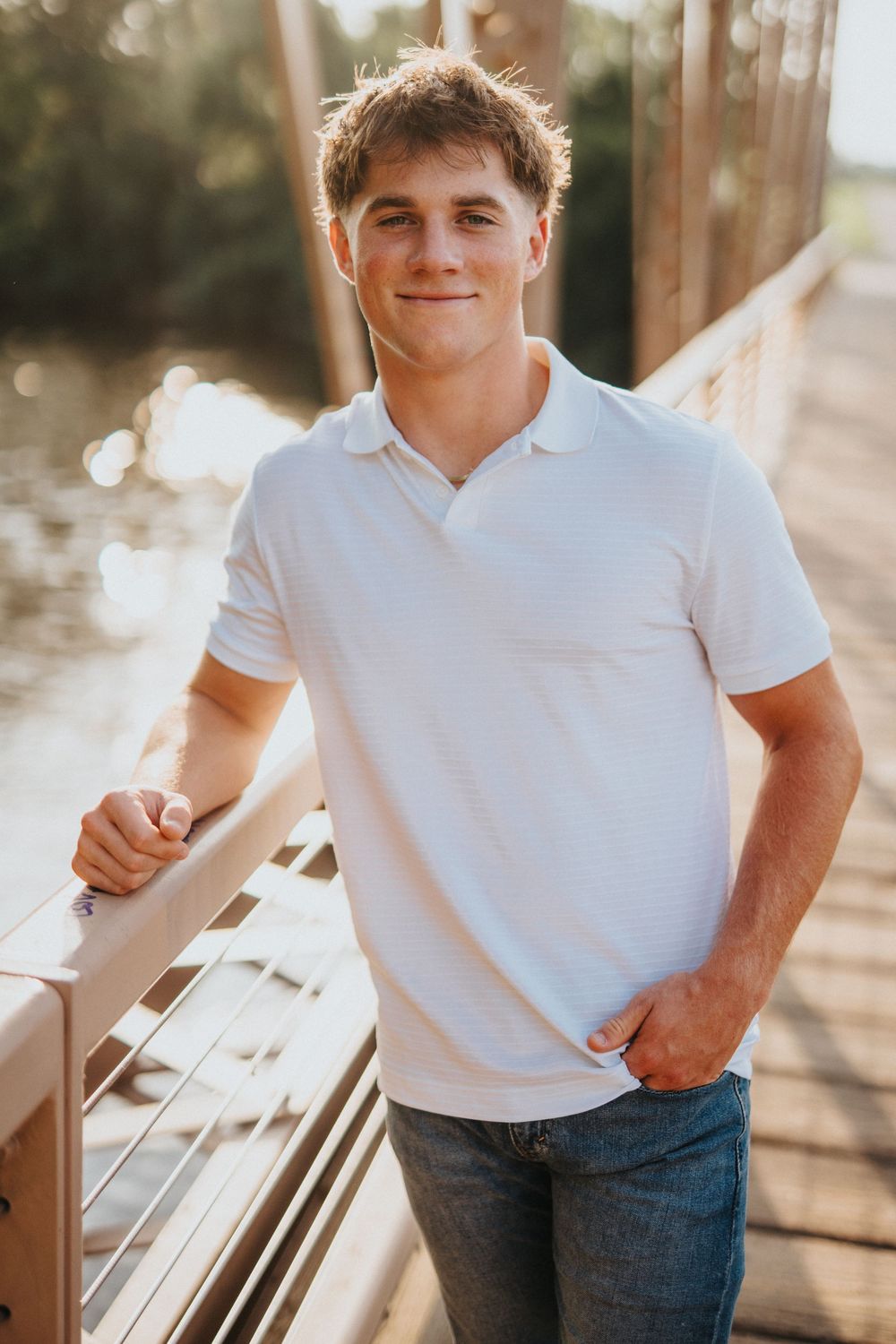 Portrait series showing someone in a white polo shirt and jeans posing against a sunlit outdoor backdrop.