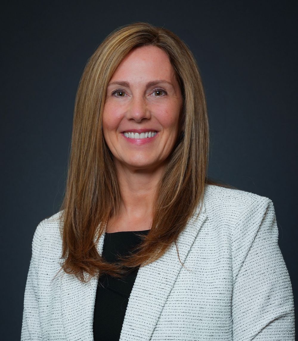 Professional headshot series showing a person in a white blazer and black top against a dark background.