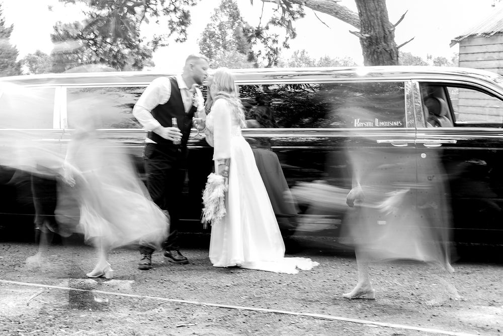 A series of black and white photographs showing blurred motion of people walking in wedding attire.