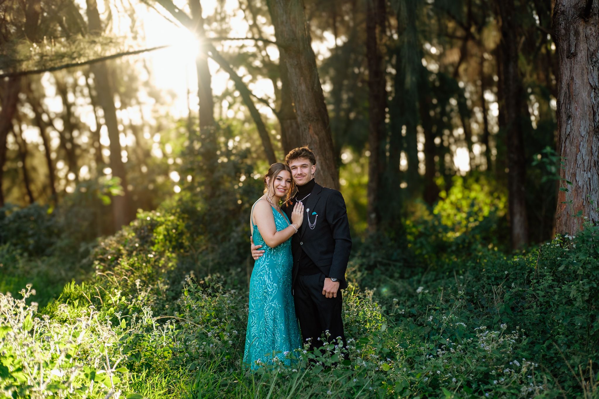 Matric farewell couple photographed in soft sunlight in a forest