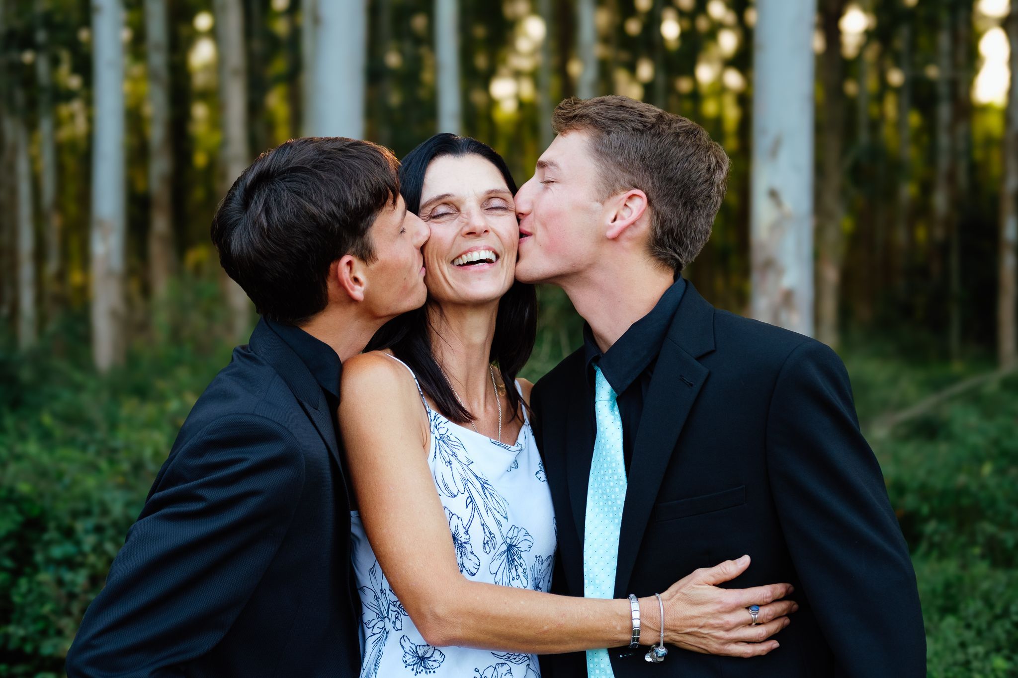 Matriculants sharing a tender moment kissing their mother before matric farewell