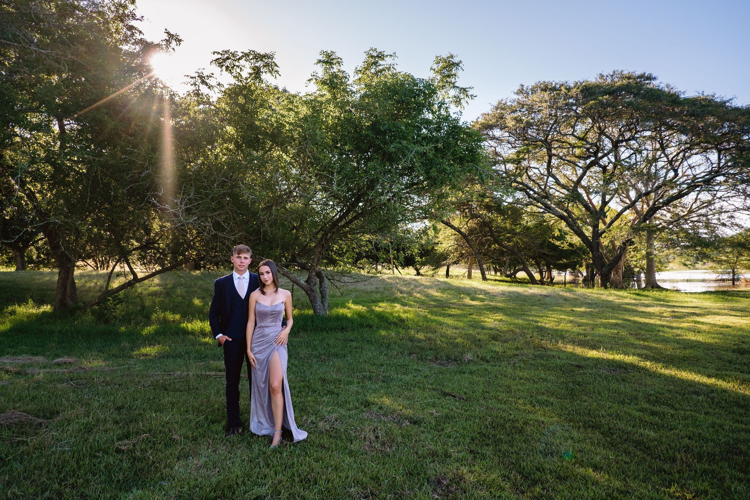 Matric farewell couple by a dam in Kwambonambi with backlit light and a lilac dress