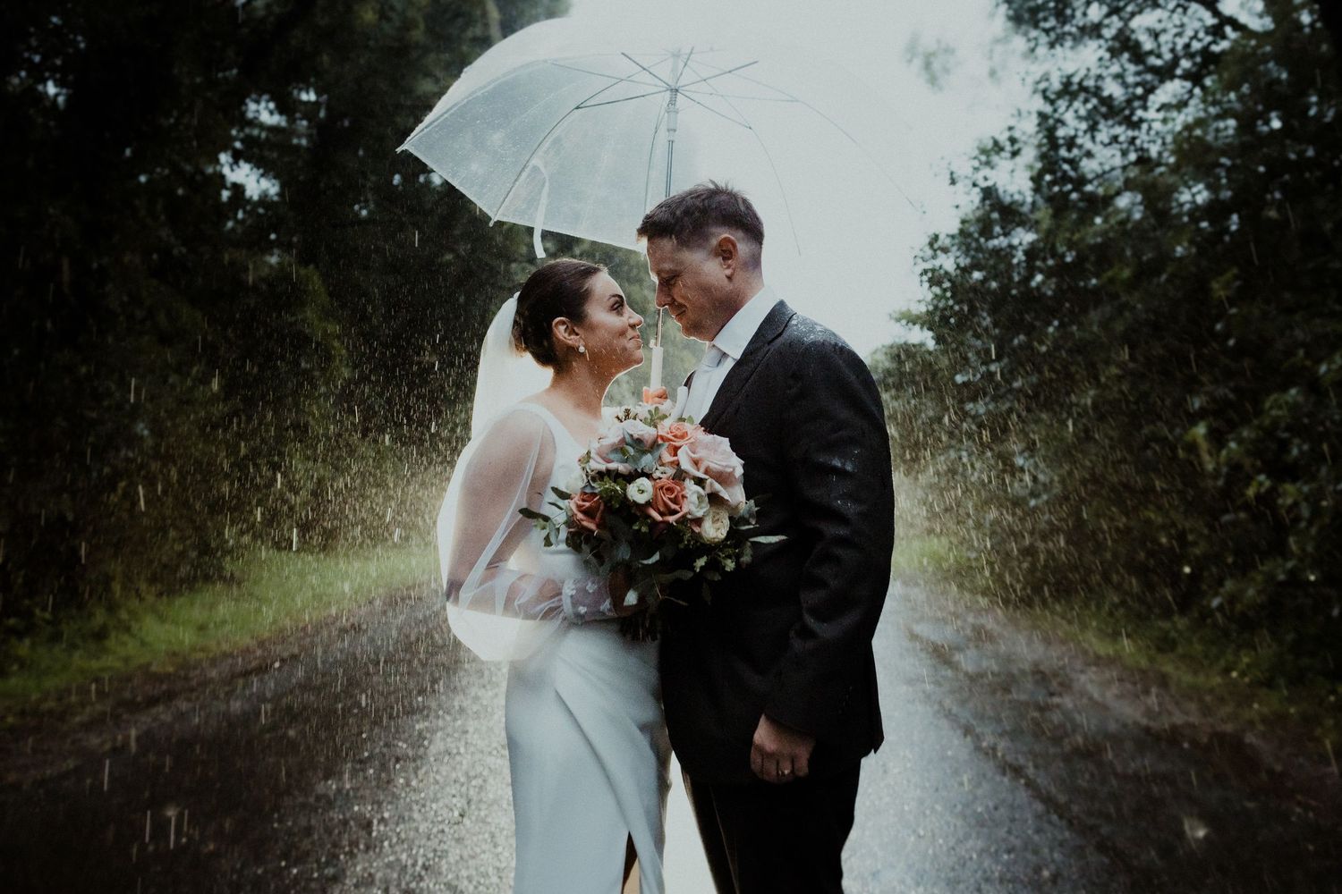 A romantic forest photoshoot with soft natural lighting filtering through the trees.