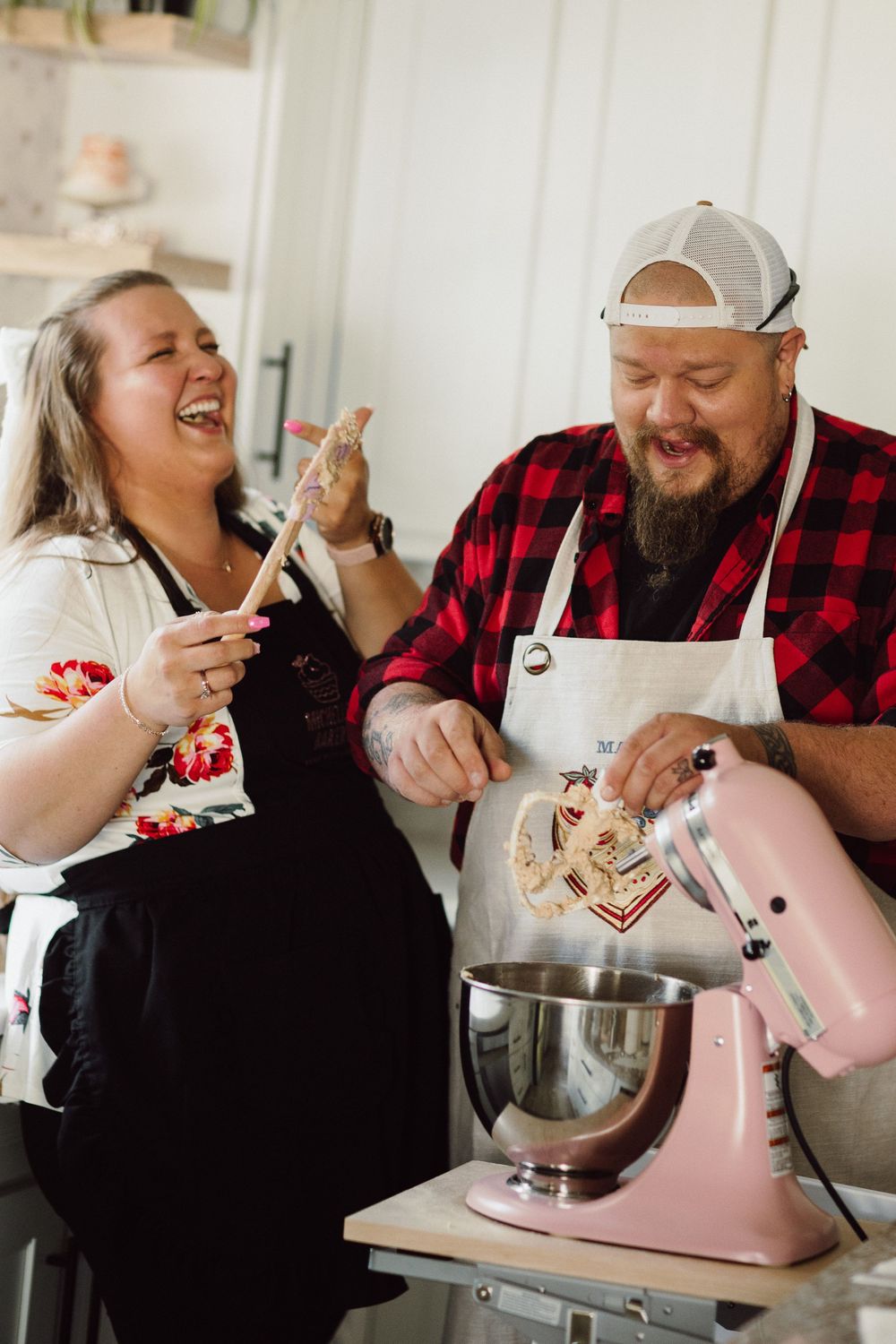 Playful baking session with a pink stand mixer and lots of laughter in a bright kitchen.