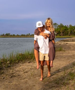 A series of five photos showing someone bending down to collect items along a coastal shoreline at sunset.