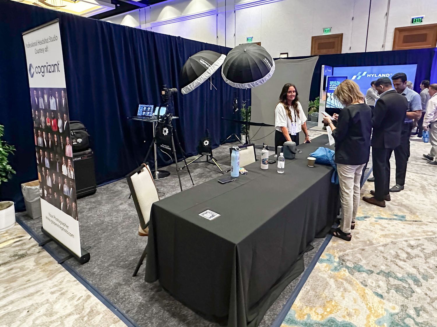 On-site corporate headshot station in Dallas set up for a conference using professional lighting and instant delivery