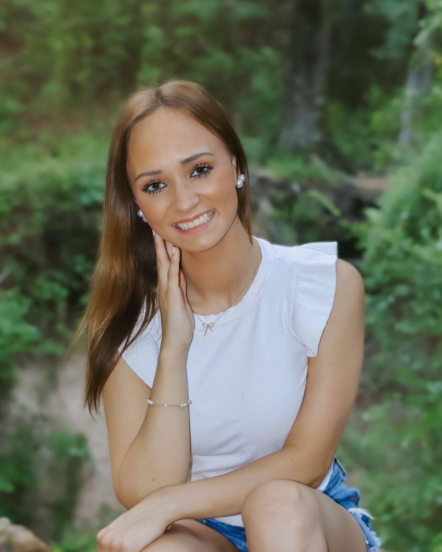 Casual outdoor portraits featuring a white sleeveless top and natural poses.