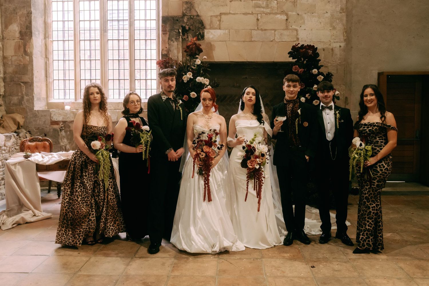 A series of wedding party photos arranged in a horizontal strip showing various group poses in a rustic stone venue.