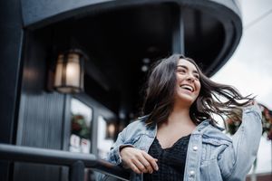 Candid photo series showing joyful expressions and laughter during an outdoor lifestyle photoshoot.