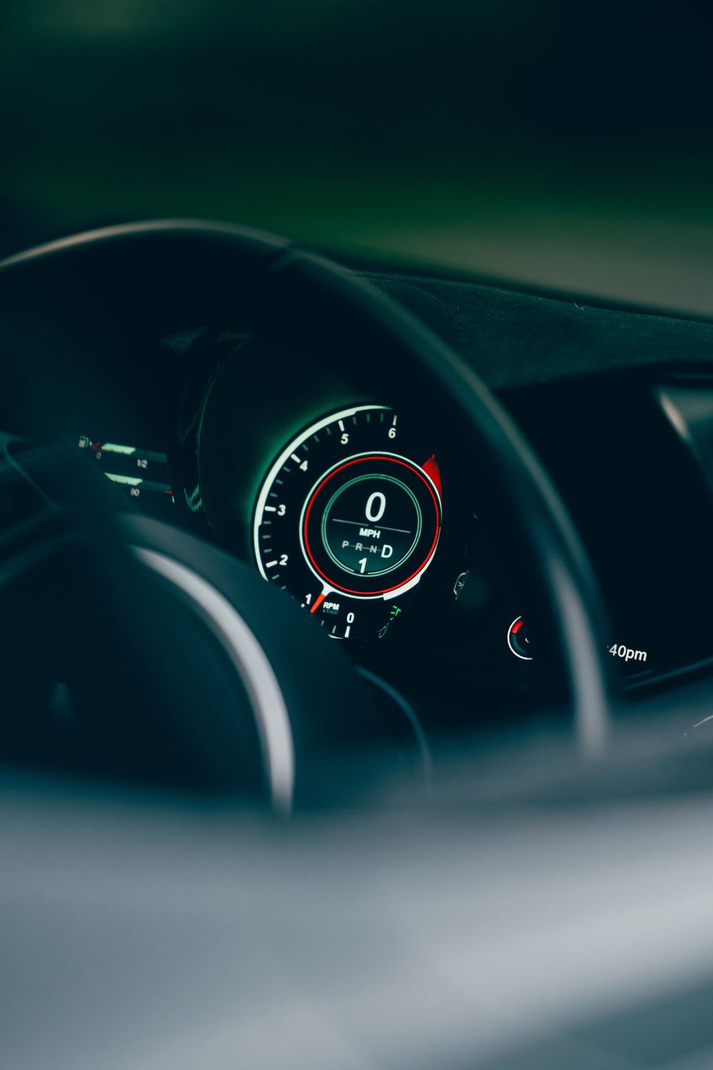 Close-up sequence of a modern car's digital dashboard display showing various instrument readings.