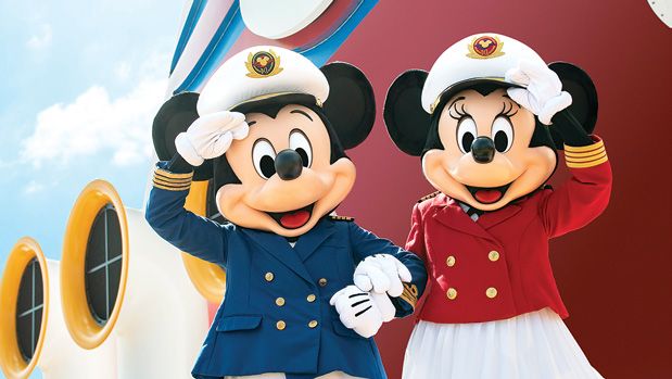 Mickey and Minnie Mouse wearing nautical captain uniforms while saluting aboard a cruise ship.