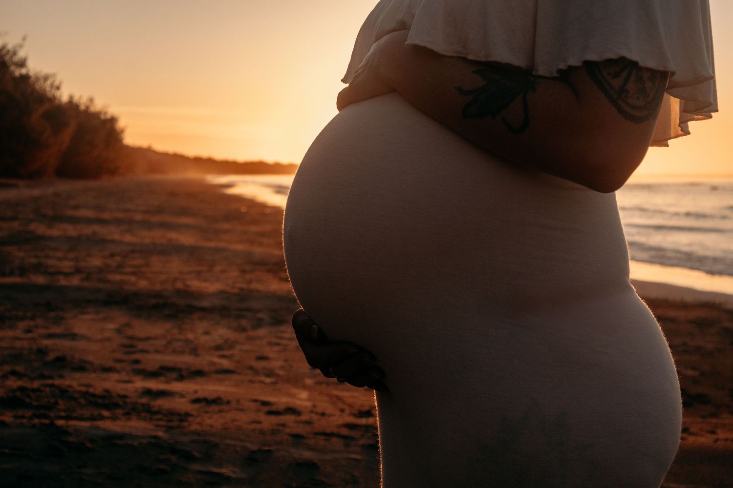 Outdoor maternity session documenting this eaningful season with softness, movement, and emotion.