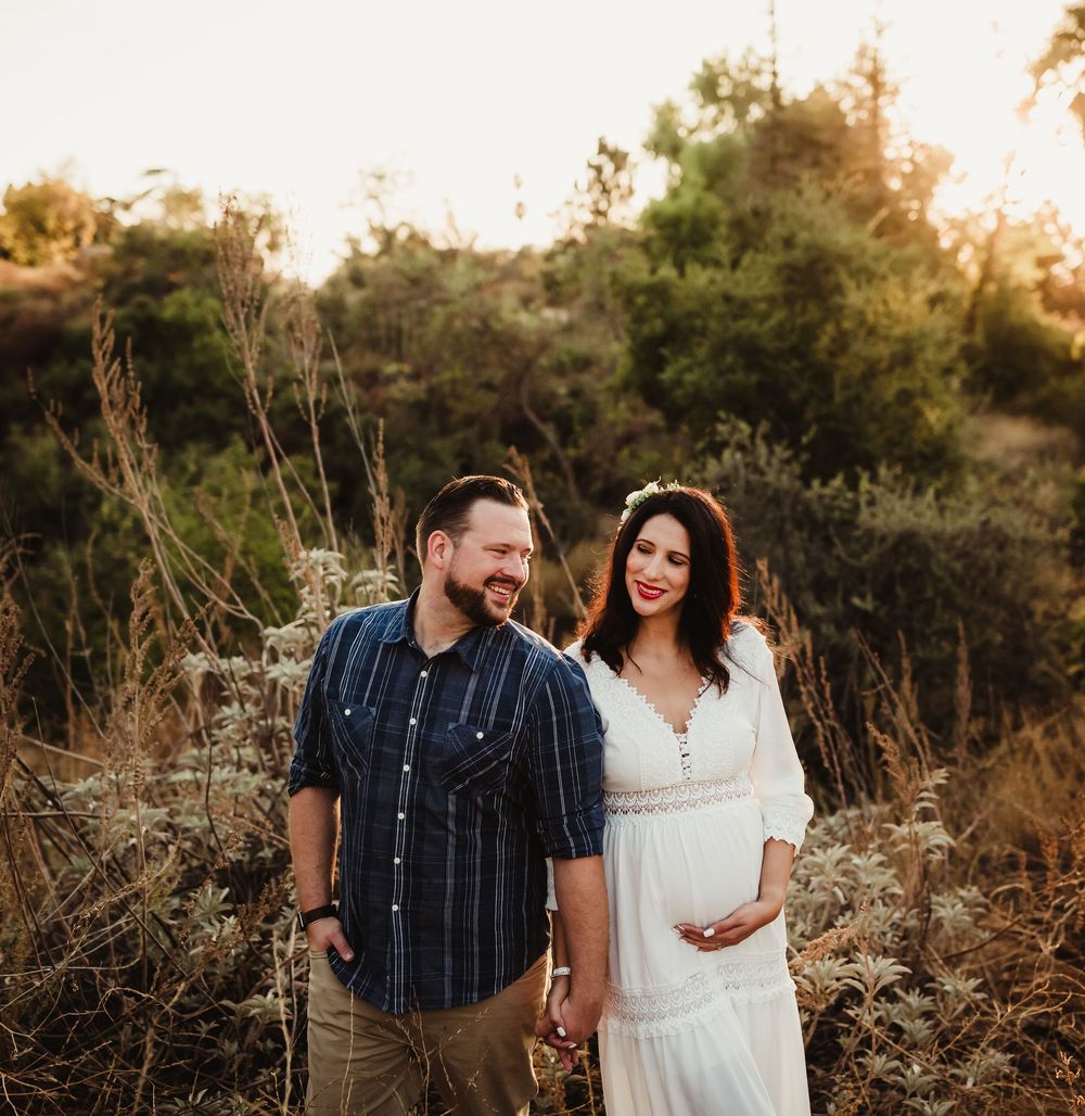 A couple shares intimate moments in a natural outdoor setting during golden hour, captured in a series of romantic poses.