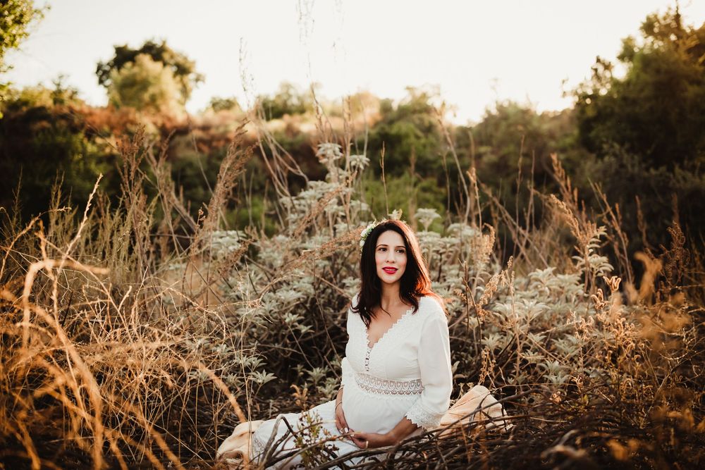 A collection of outdoor maternity photos showing a pregnant woman in a white dress amid golden sunlit fields.