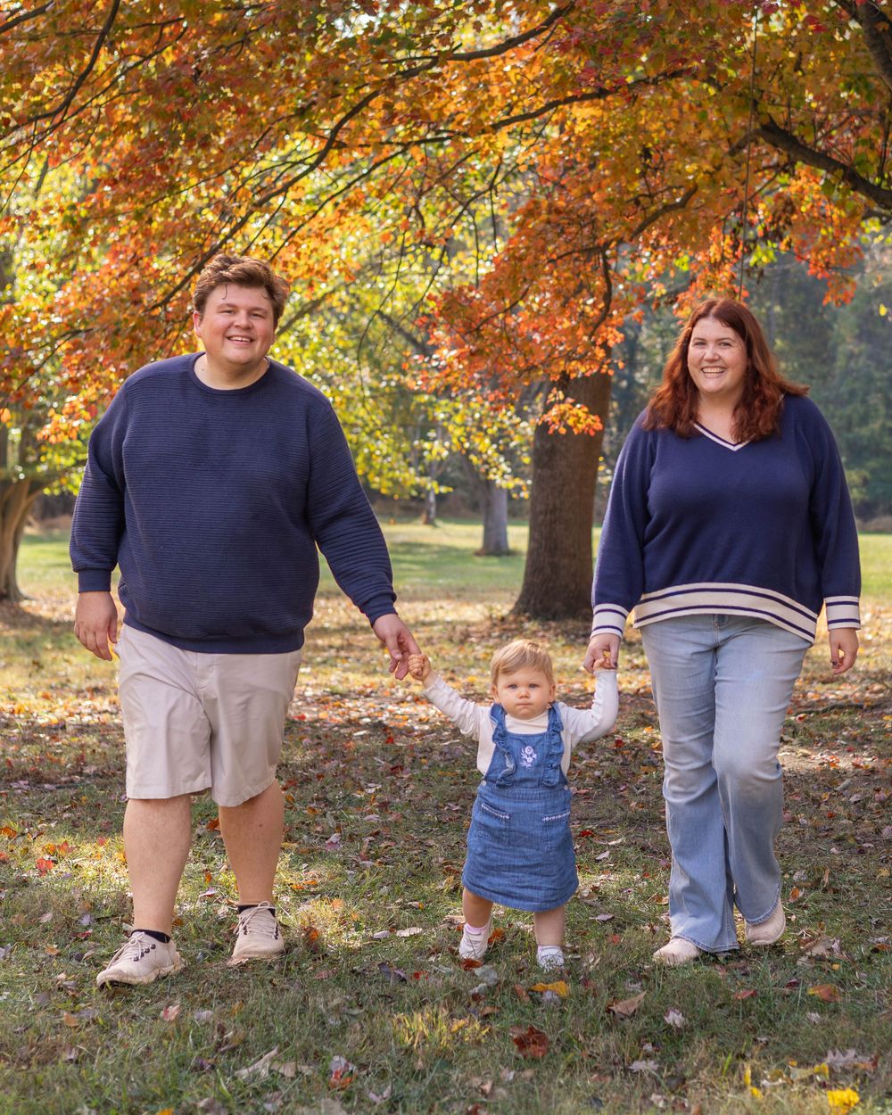 A series of candid photos showing people walking together through a park with vibrant autumn foliage in the background.