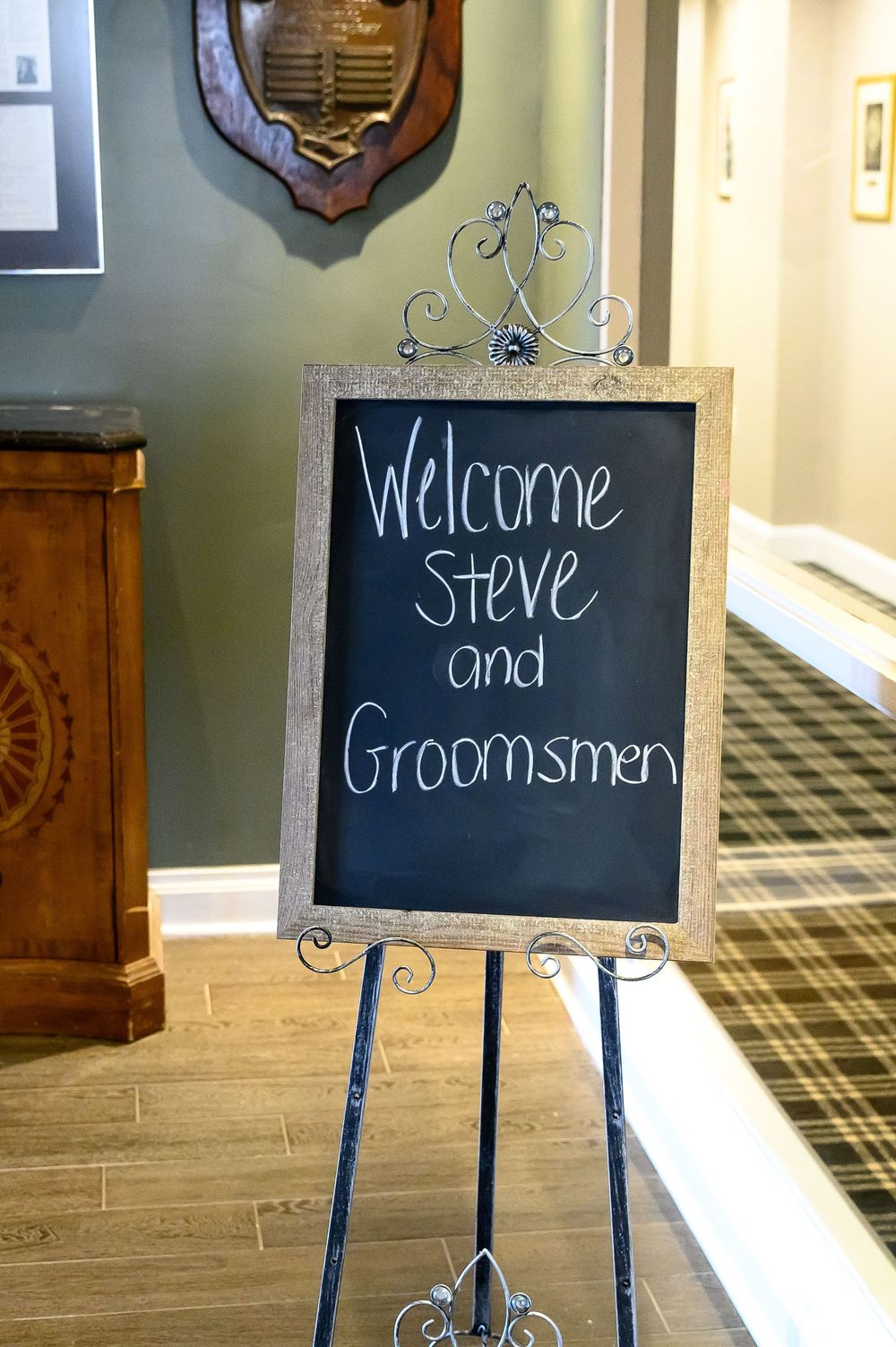 Decorative chalkboard signs with welcome messages displayed on easels in an elegant venue.