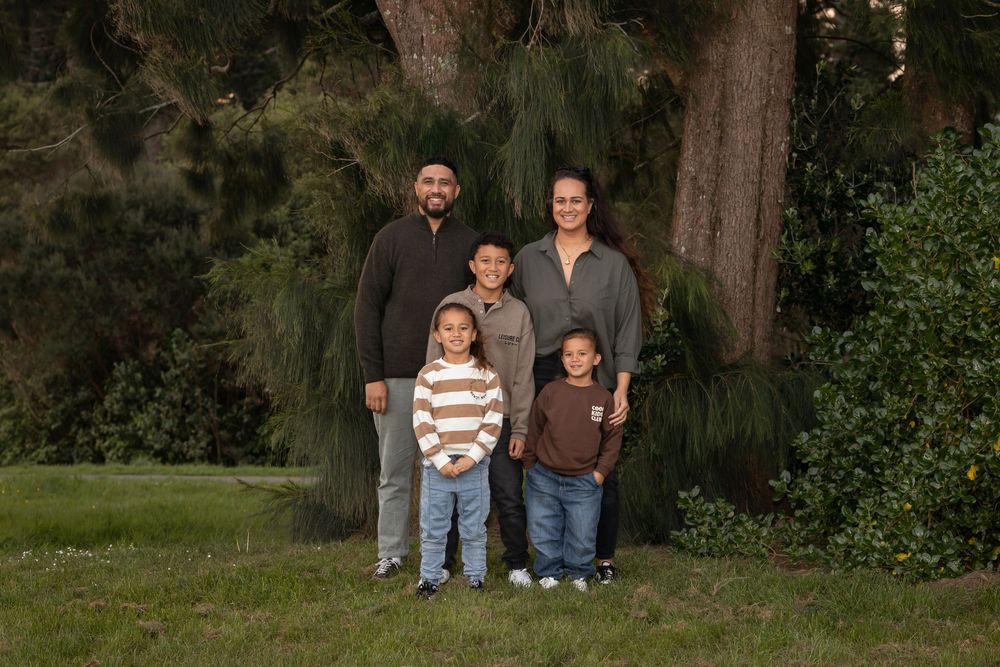 Professional Family photo taken in a forestry setting. Family Photoshoot by Catherine Lundin Photography. Auckland