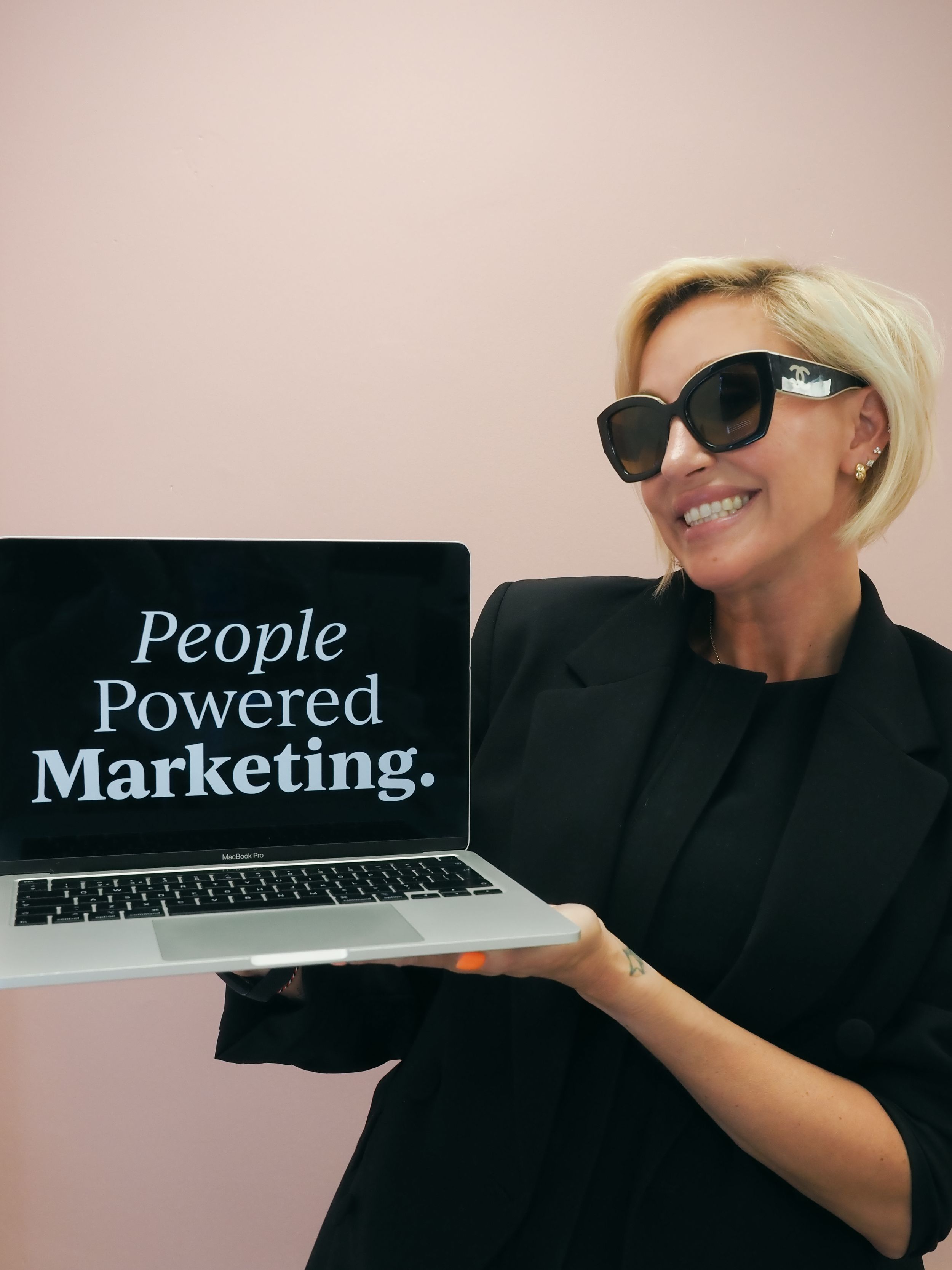 Professional style laptop with business marketing text display shown from various creative angles against dark background.