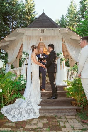 A series of photos showing a wedding ceremony under a white draped gazebo with greenery and flowers in an outdoor garden setting.