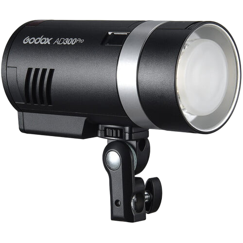 Black and silver Godox AD300Pro portable studio strobe flash with integrated mount for photography lighting.