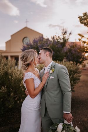 Newlyweds share an intimate moment outside at sunset. Affordable wedding photographers in Albuquerque. Queer wedding photographer New mexico