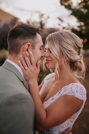 A romantic wedding couple shares an intimate moment at sunset. Romantic wedding photographers New Mexico. Queer elopement photographers abq