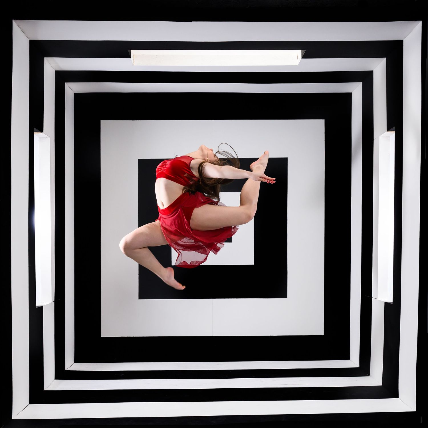 Artistic dance movements framed by striking black and white geometric patterns.