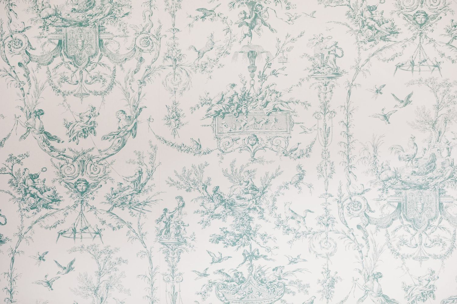 Vintage floral wallpaper pattern in soft green and white colors showing delicate damask designs.