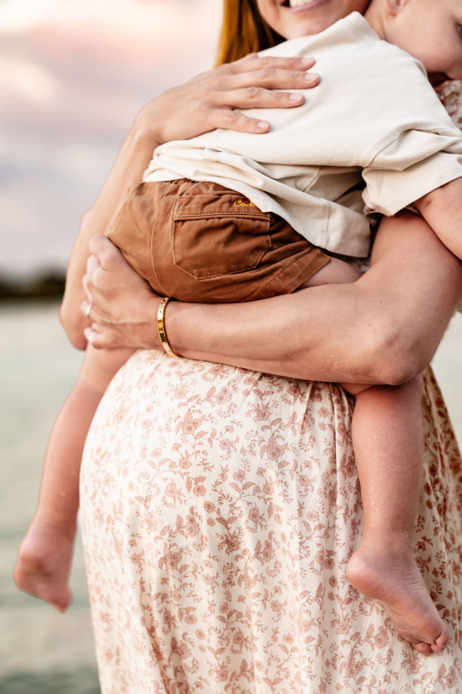Mama snuggling her little while doing her maternity session in Dorado Beach, Puerto Rico
