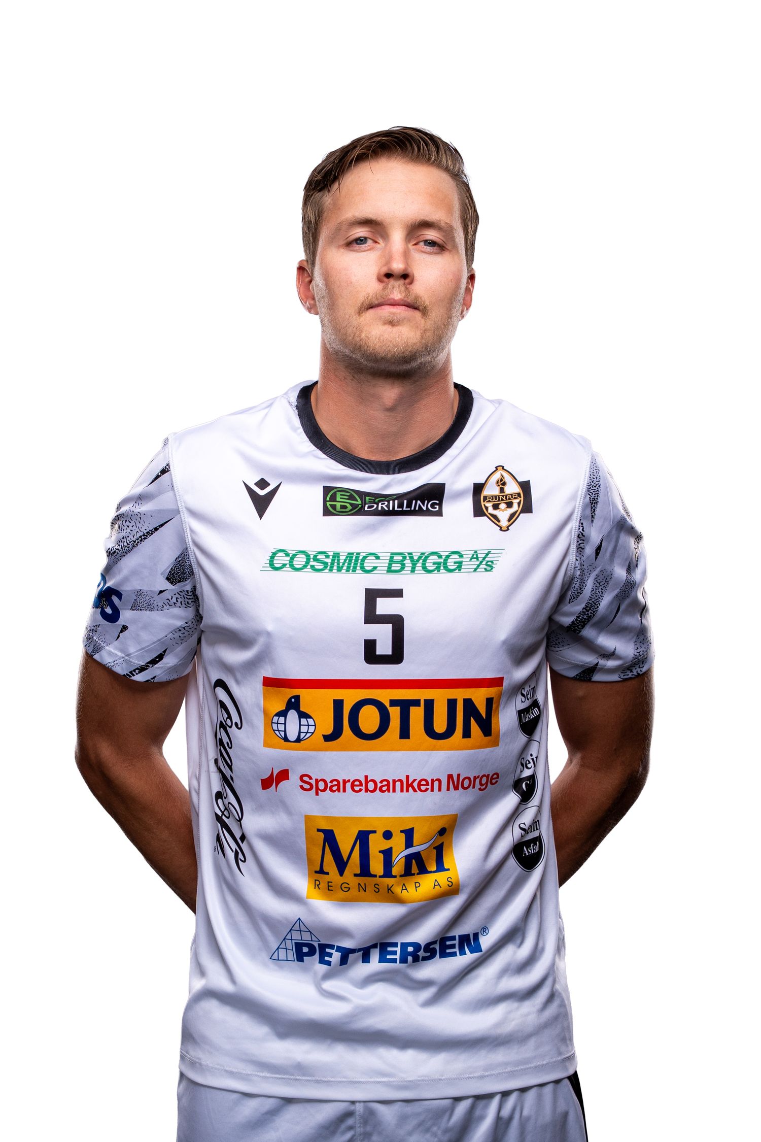 Athletes wearing white jerseys with various sponsor logos displayed prominently stand together.