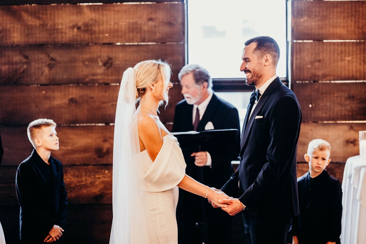 Emotional first look between bride and groom before ceremony