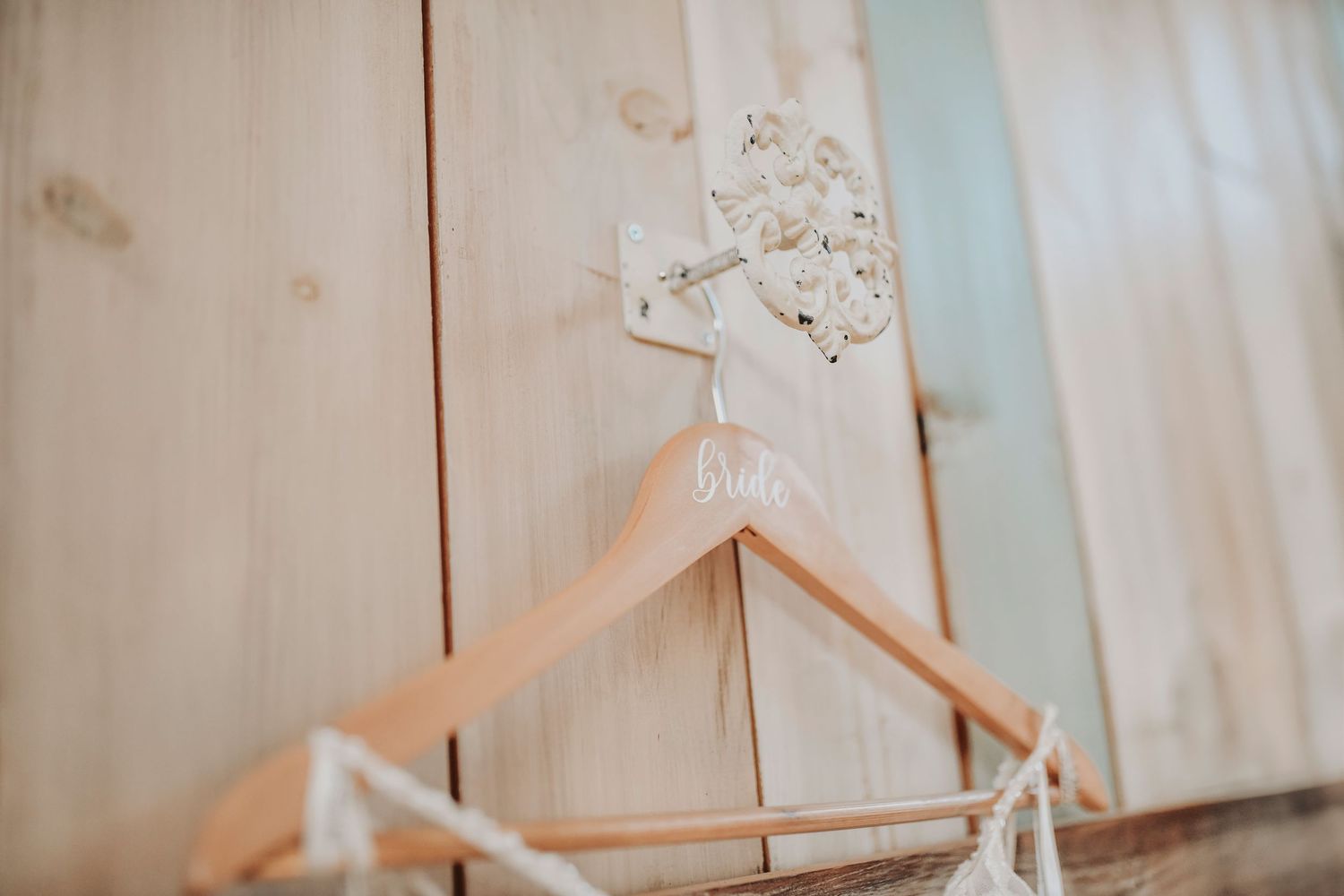the brides hanger hanging in her bridal suite