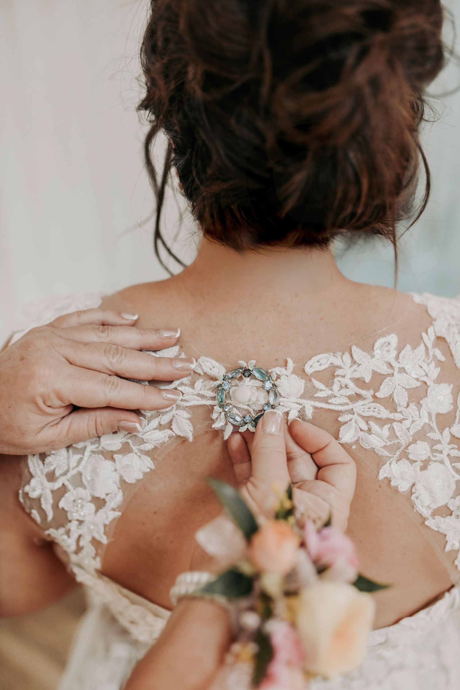 Bride and mother sharing special moment in Shiplap Bridal Suite at Whispering Oaks