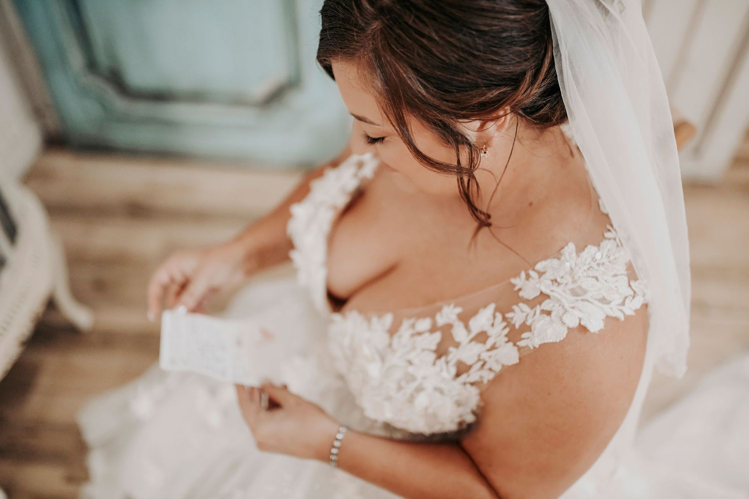 Emotional moment of mother dressing bride at Whispering Oaks