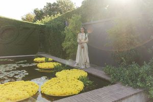 Bride walking through the gardens of Johannesdal 1207 wedding venue