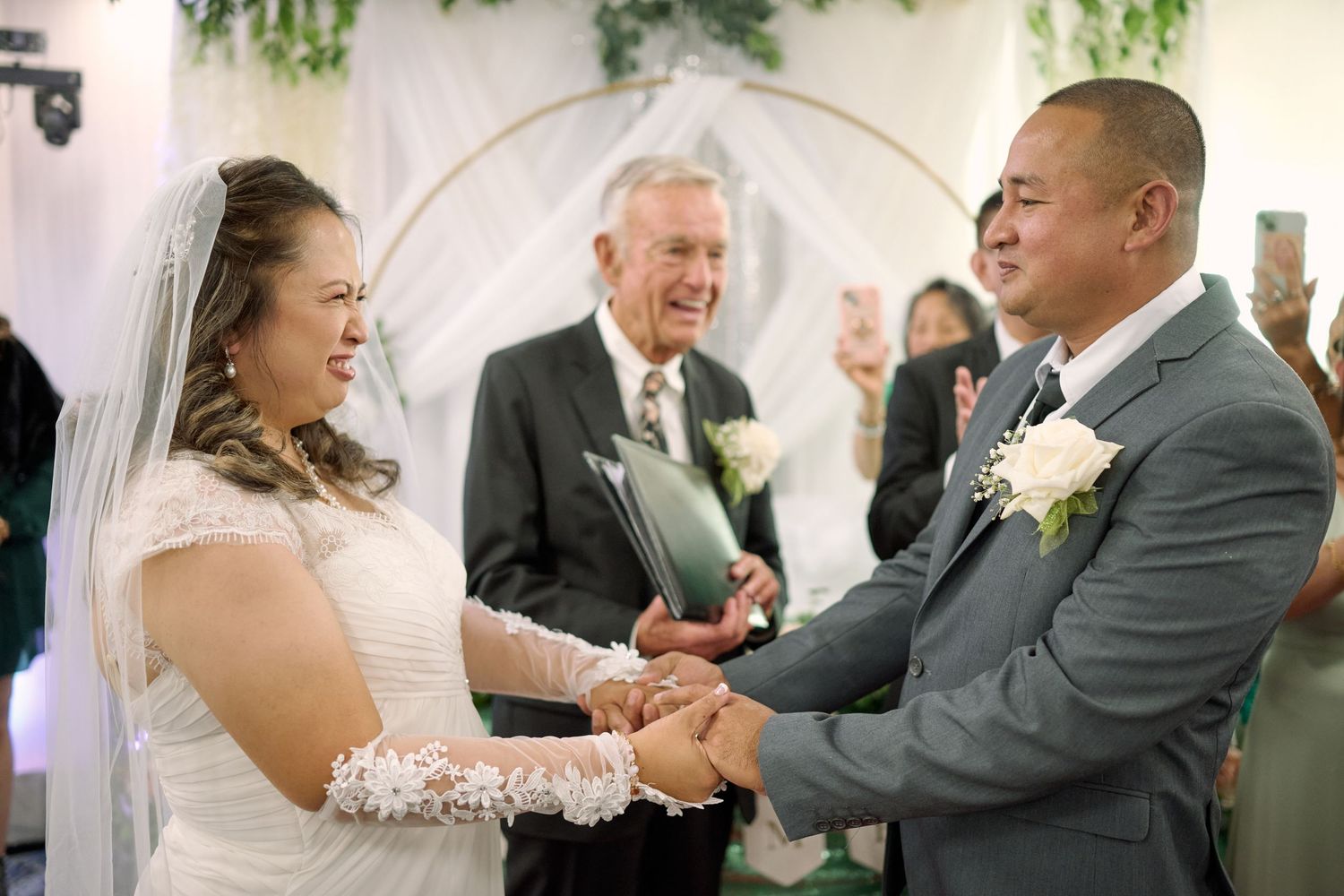 A series of candid wedding photos showing dance floor moments between couples at an elegant reception venue.