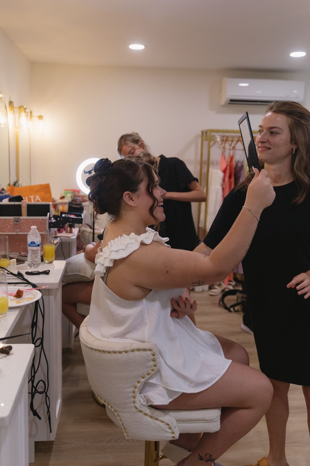 Bride taking the first look at her wedding updo on her north georgia wedding day
