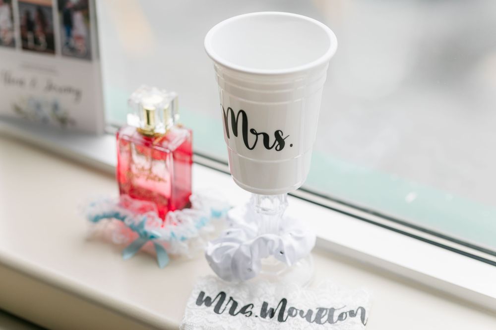 A collection of home decor items arranged on a windowsill with soft natural lighting.