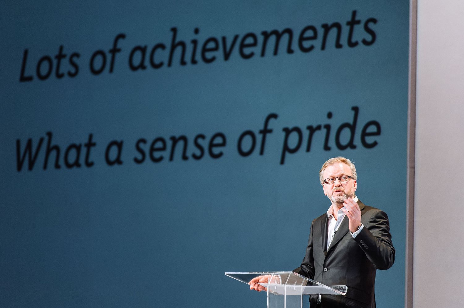 Professional presentation screen displaying text about achievements.