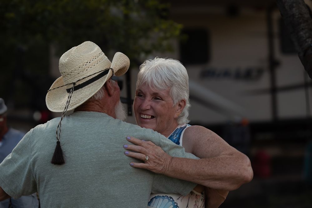 A couple dancing together in an outdoor setting.