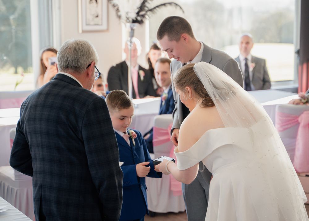 Candid moments captured during wedding reception with guests mingling.