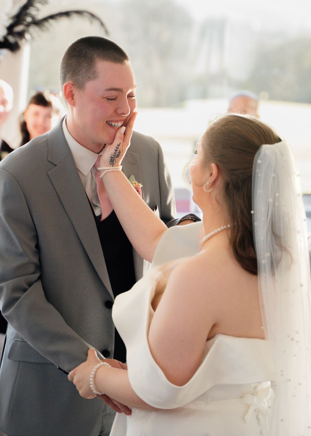 Emotional first look reactions captured during wedding ceremony.