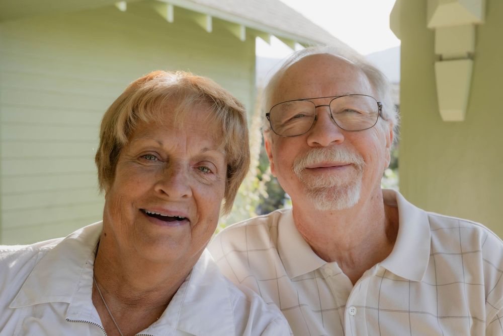 Candid indoor photo showing people sharing a joyful moment together.