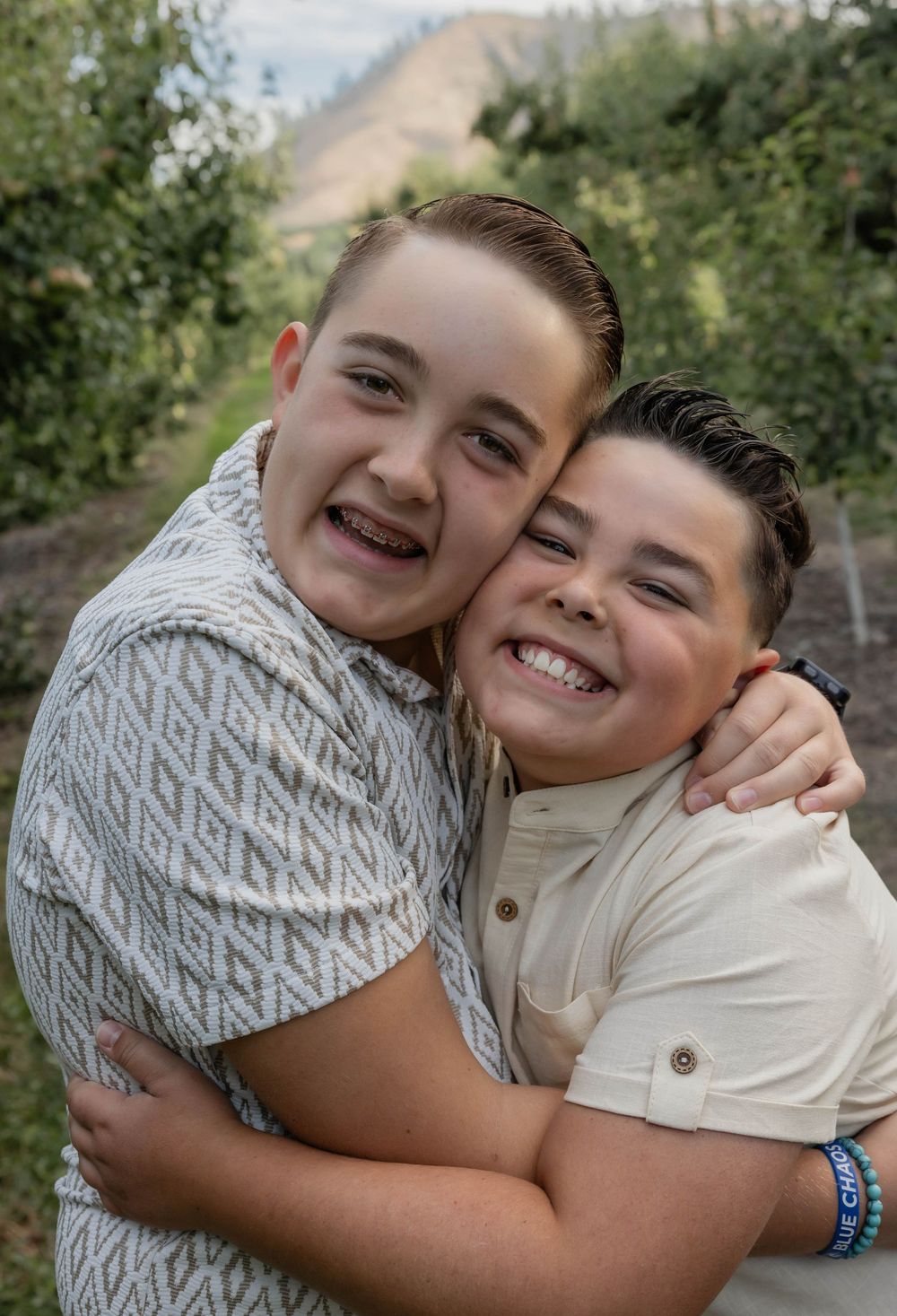 Two young people sharing warm embraces and genuine laughter in a series of candid photos.