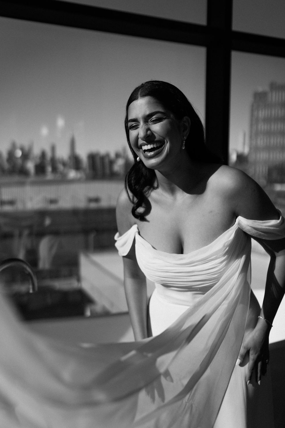 Artistic black and white fashion sequence with flowing white fabric.